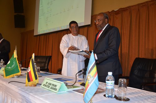Mohamed Ag Bendech presenting the 2015 GNR and Africa Brief to Prime Minister (Uganda circa 2015) Rt. Hon. Ruhakana Rugunda