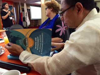 Health Undersecretary of State Gako reading the GNR 2015 Report
